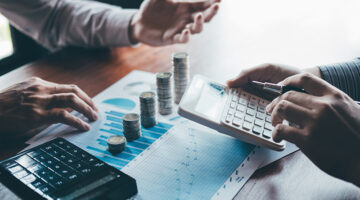 Two business men discussing ways to raise money for their business.