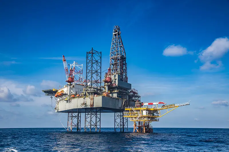 Offshore oil and gas drilling rig while completion well on oil and gas wellhead remote platform.