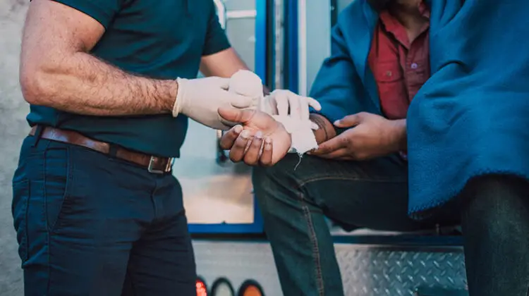 Paramedic administering first aid