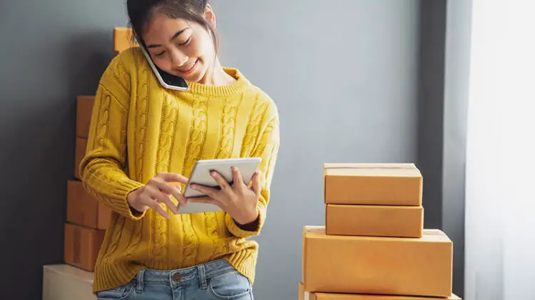 Young woman entrepreneur doing an inventory check