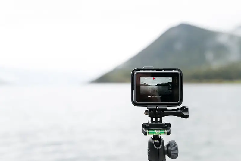 Black camera recording the seaside view