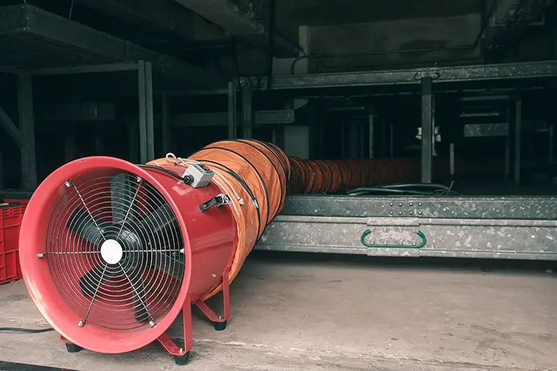 Red blower flow air for confined space work in factory