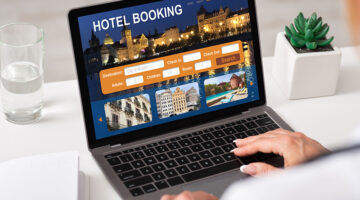 Unrecognizable businesswoman using hotel booking website