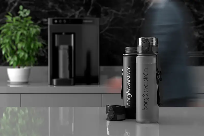 Black and gray water dispenser and water bottles