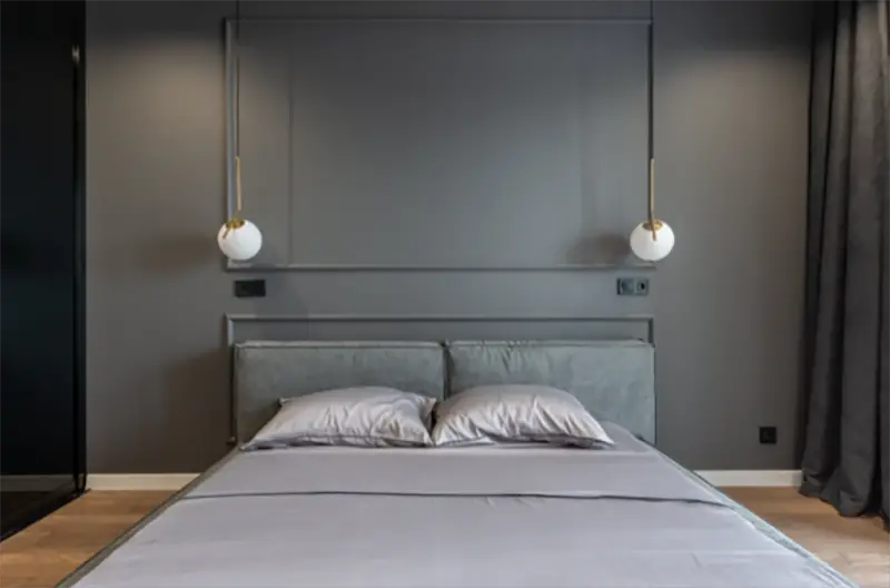 Bedroom in gray painted wall and gray bed sheets
