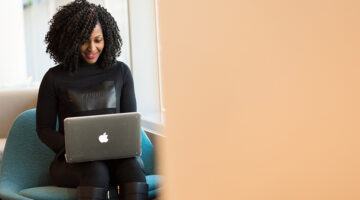 Woman holding Macbook