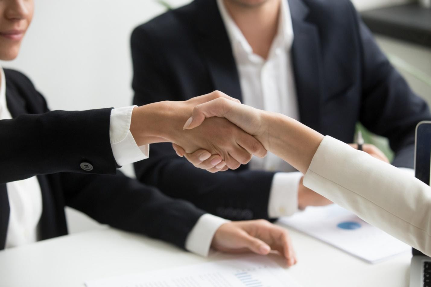 Business people handshaking