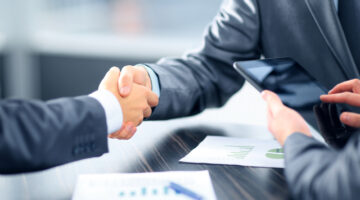 Business people shaking hands in office