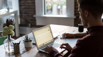 man using laptop in his office