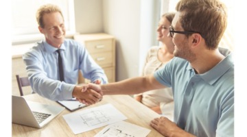 Real estate agent handshake with his client