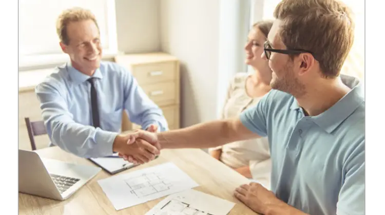 Real estate agent handshake with his client