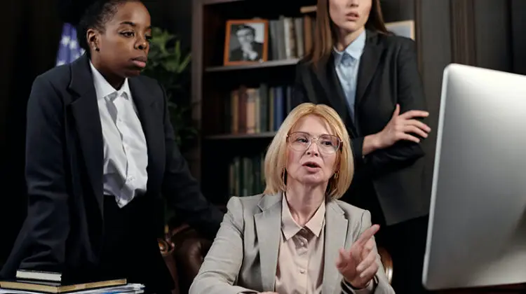 female lawyers in an office looking at the computer