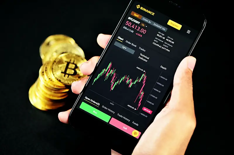 Black smartphone displaying cryptocurrency trading