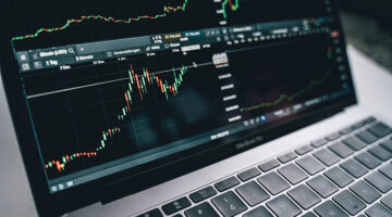 wicks and candles - trading indicators on laptop screen