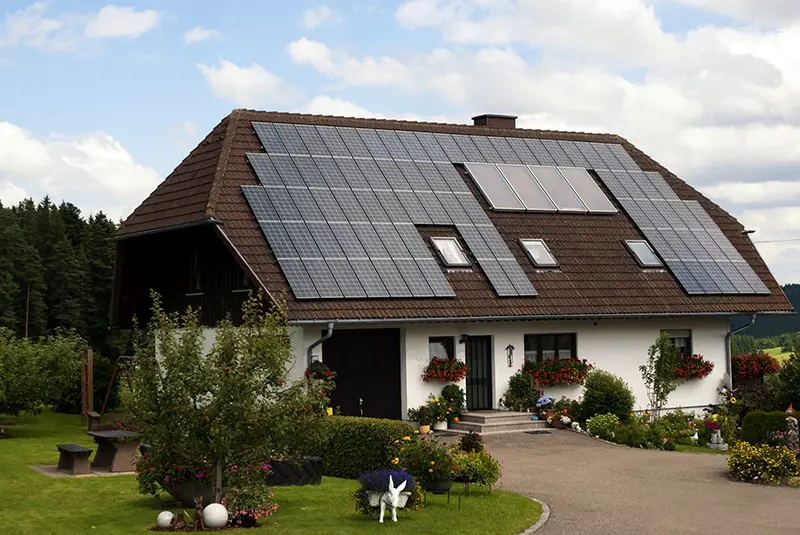 House with Brown roof with solar panels
