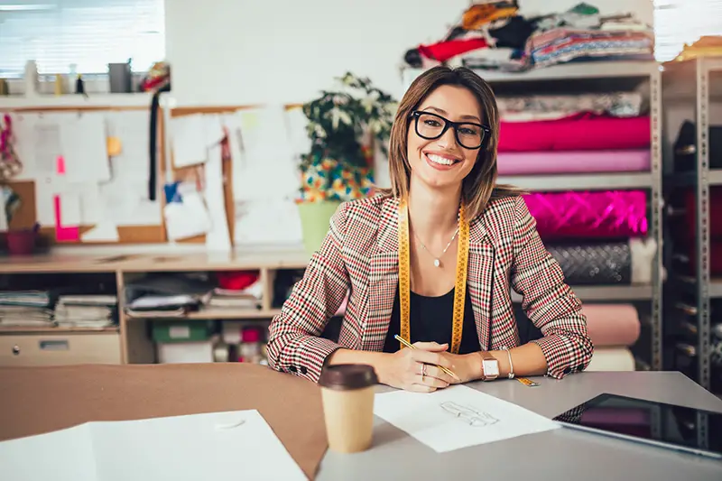 Woman entreprepreneur sitting on her desk