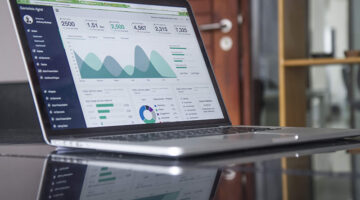 Laptop computer on the top of glass table