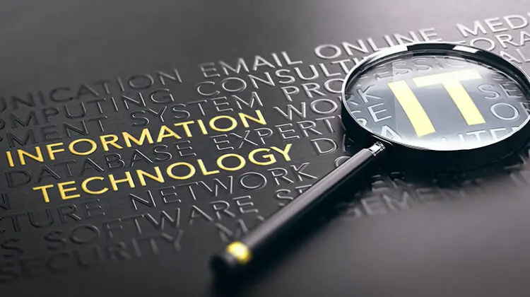3D illustration of a magnifying glass over black background and focus on golden IT acronym.