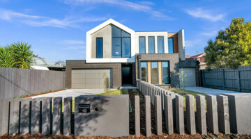 White and brown concrete building under blue sky