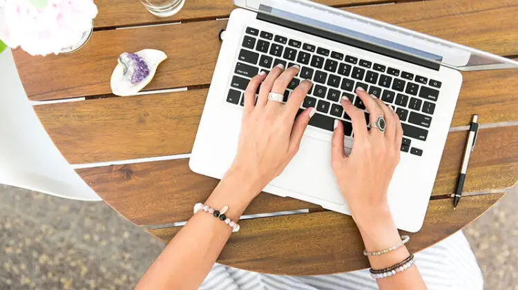 Hand of a woman using Macbook pro