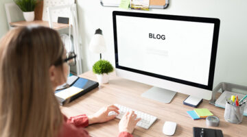 Woman wearing eyeglasses working in front of her computer