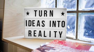 Black and white quote on frame near the window