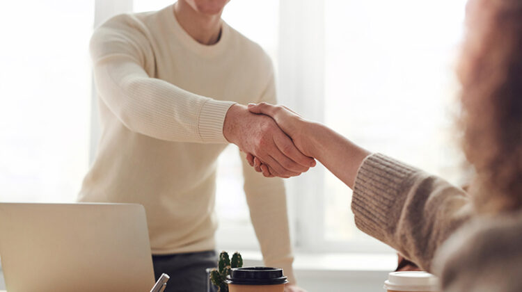 Man and woman doing a handshake