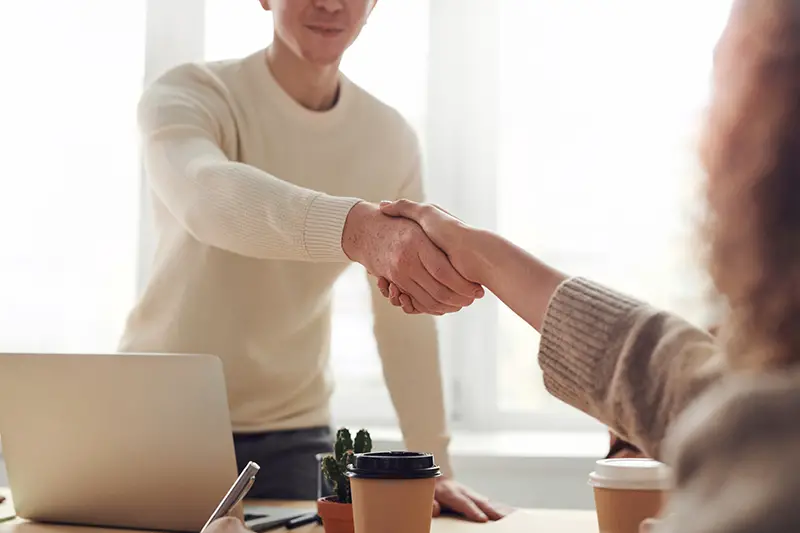 Man and woman doing a handshake