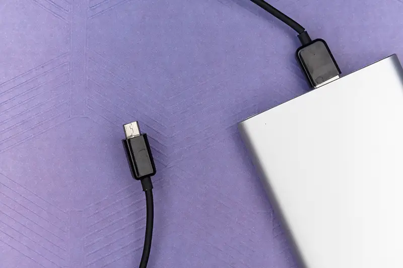 black usb cable on white laptop
