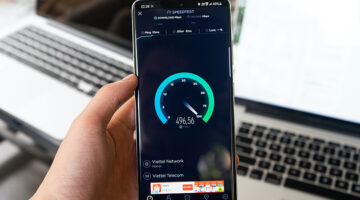 Black smartphone displaying internet speed test