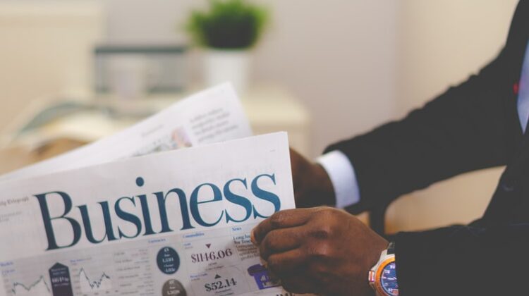 Businessman reading business newspaper
