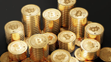 Close up shot of Bitcoin coins isolated on black background