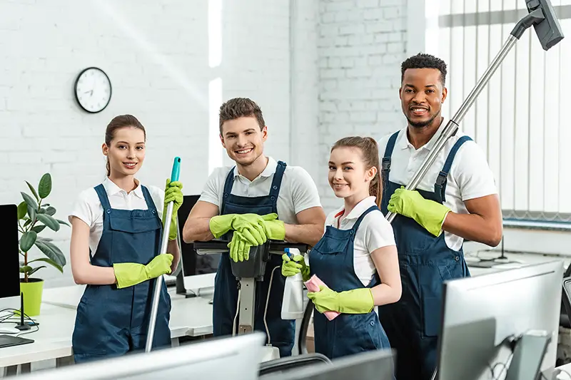 A group of happy multicultural cleaners 