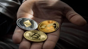 Hand of person holding bitcoin