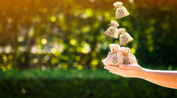 Women hands hold a money bags