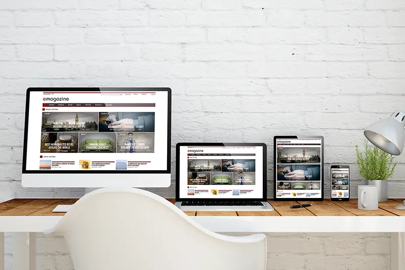 multidevice desktop with e-magazine website on screens