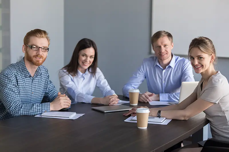 Group of business people  sitting at conference table