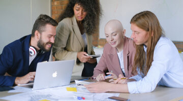 group of diverse business people working together with laptop