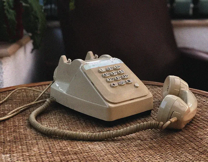 Off white old landline telephone