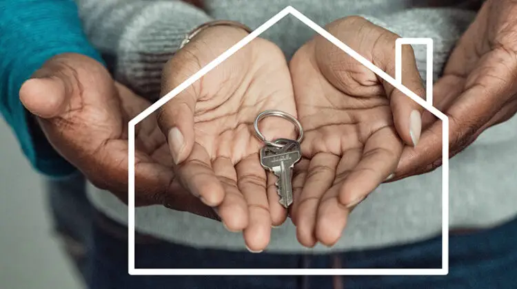 House key on couple's hand