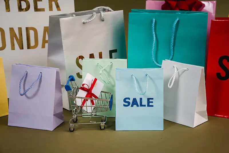 paper bags with sale text on the table