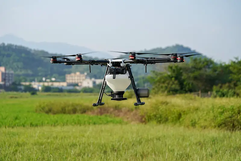 Agriculture white drone in the middle of the field
