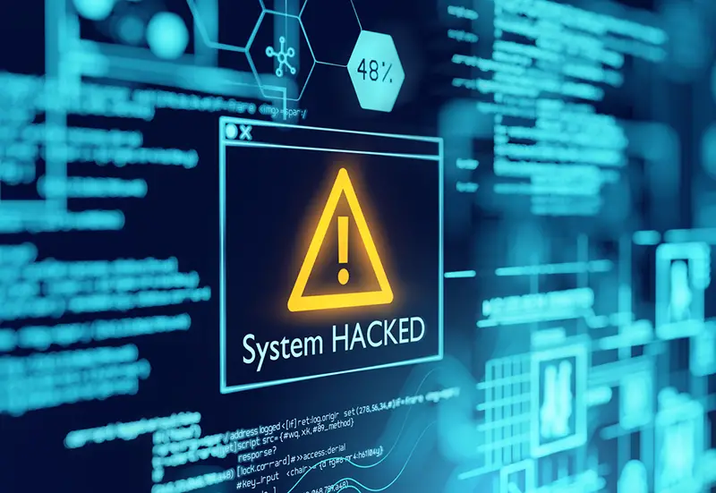 A computer popup box screen warning of a system being hacked