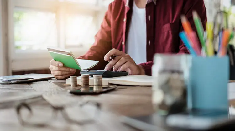 Business man hands holding saving account passbook