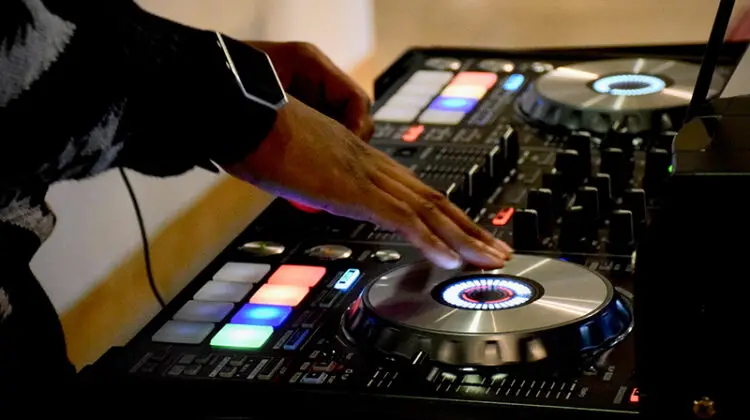 Person using DJ turn table