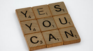 close-up photo of yes you can text on white surface