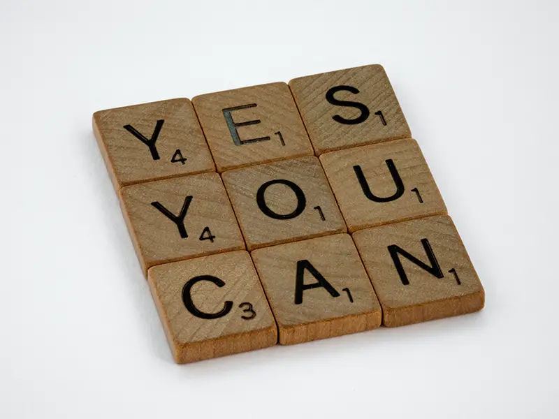 close-up photo of yes you can text on white surface
