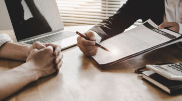 Businessmen having a contract signing for business license