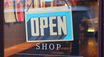 gray and blue open signage