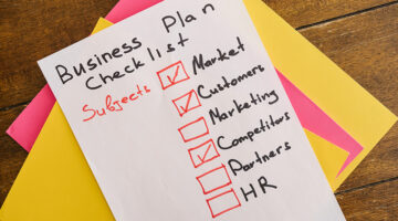 Business plan checklist on a white piece of paper